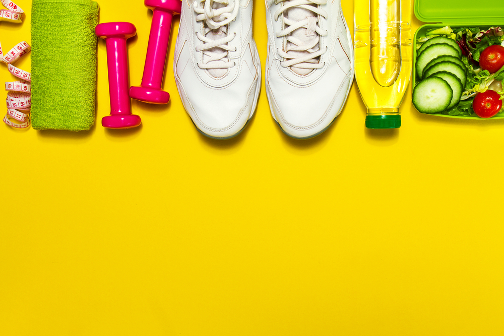 Healthy lifestyle, food, sport or athlete's equipment on bright background. Flat lay. Top view with copy space.